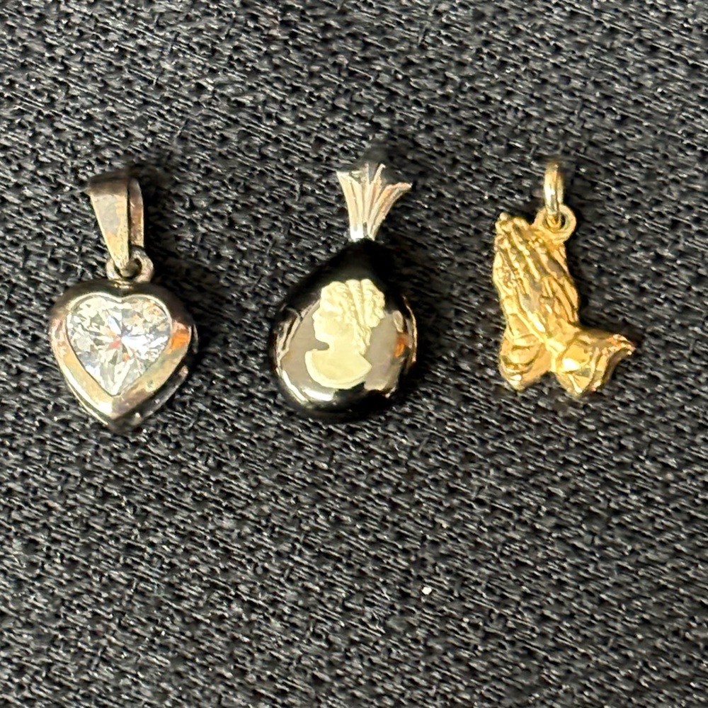 Three vintage necklace pendants